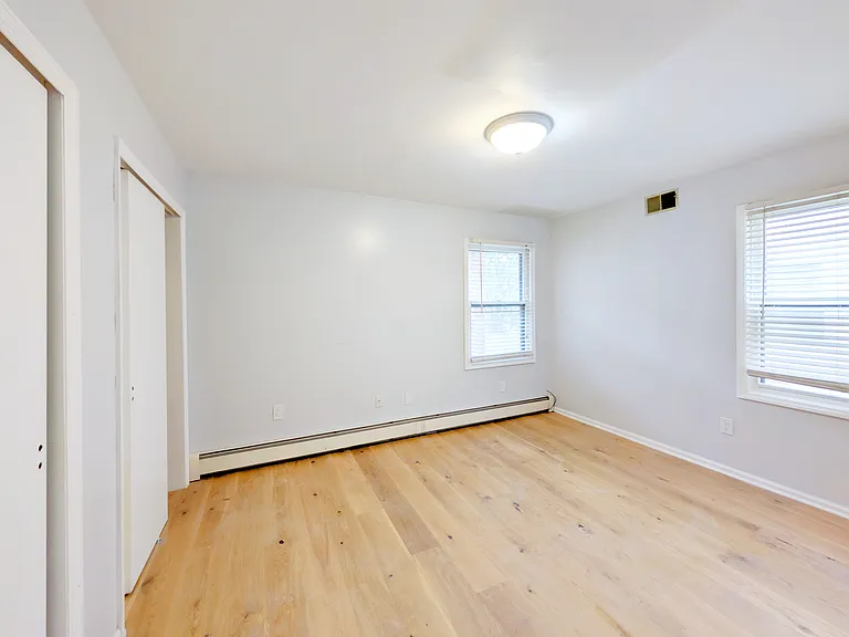 Primary Bedroom w/2 Double door closets (new wood floor, new ceiling light)