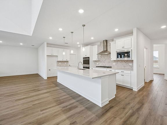 Open-concept throughout main living areas photos depict options and features that may not be availa