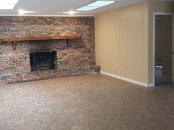 Large Family room with wood burning Fireplace
