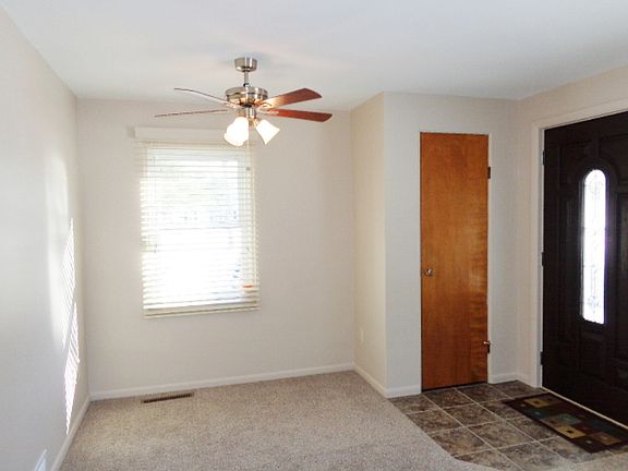 Light and bright dining area open to the living room. This area could be used for your computer/desk.