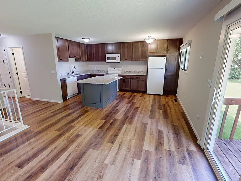 View of the kitchen and patio door