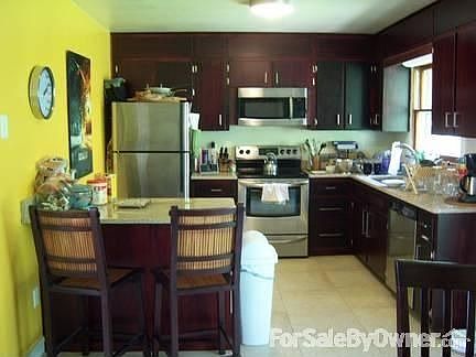 All new stainless steel appliances : Granite countertops, porcelain tile, breakfast bar, dining area