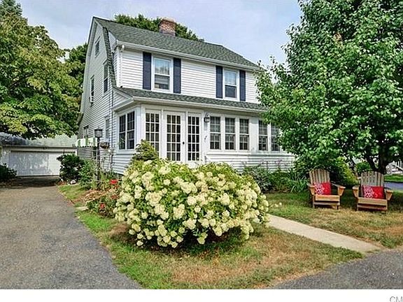 Nice driveway w/ newer 2 car detached garage.   Great yard for lounging in adirondack chairs while watching the kids play