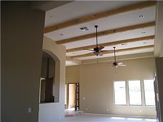 Check out these vaulted ceilings with fantastic beams in your great room