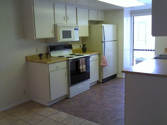 bright and wide kitchen area with two windows