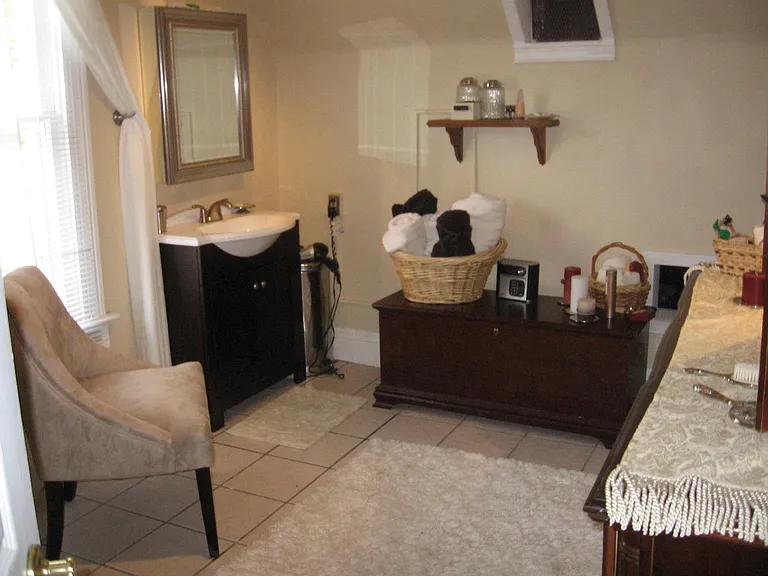 Upstairs Bath including a shower and commode that you can't
