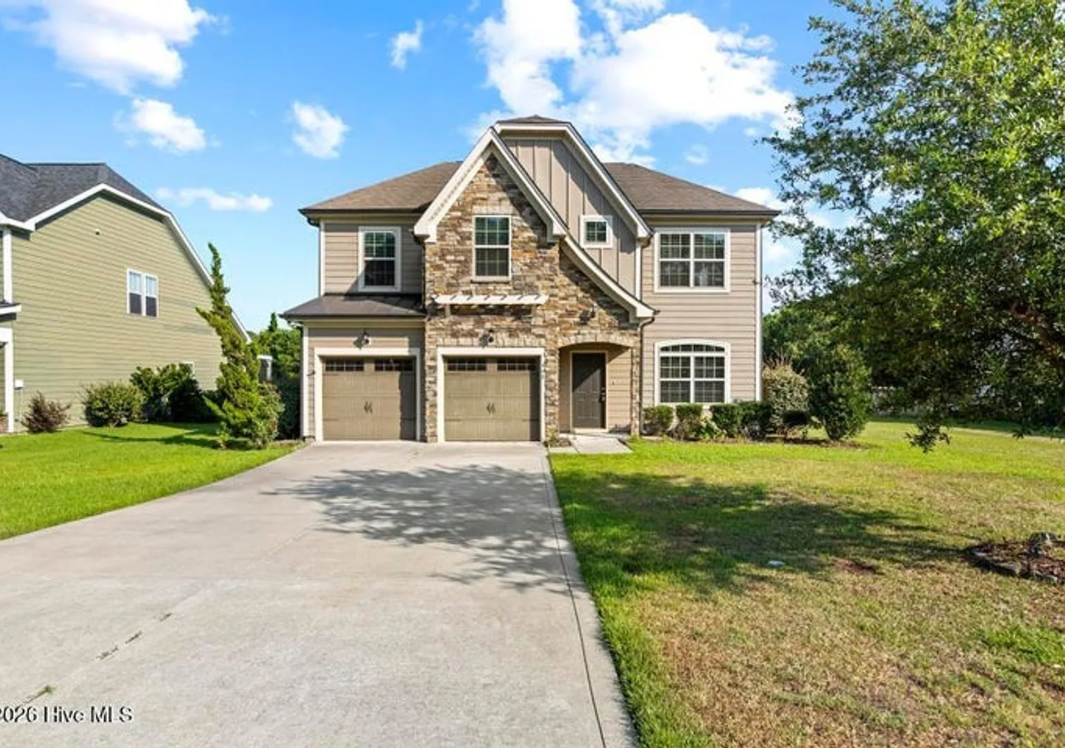 Set along a peaceful pond in the gated community of Mimosa Bay — Photo 1