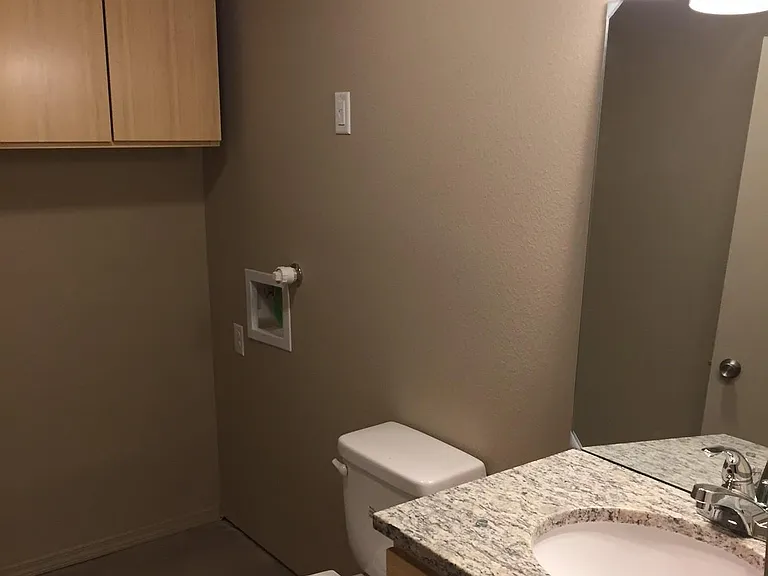 Laundry room with 1/2 bath downstairs and full-size washer and dryer