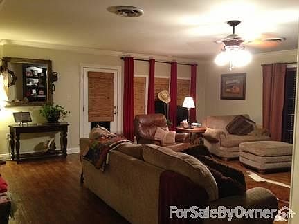 Brick family home
						:
						with two car carport, and circular drive