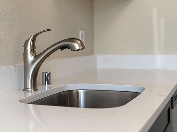 No expense spared in creating dream kitchens, complete with undermount sinks, brushed nickel high-end faucets and stainless steel appliances
