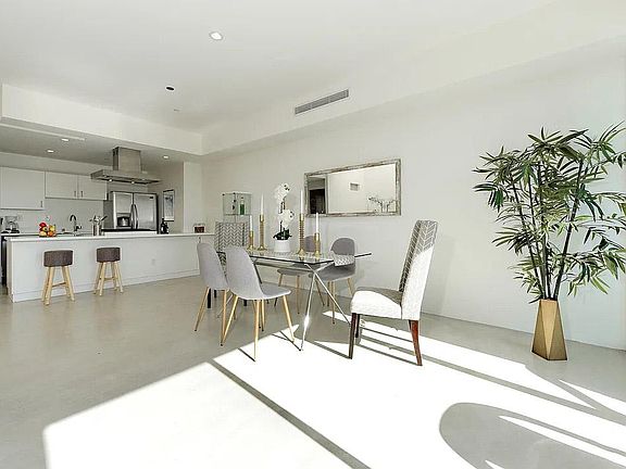 Living room, dining area, and kitchen are an open floor plan which are perfect for entertaining.