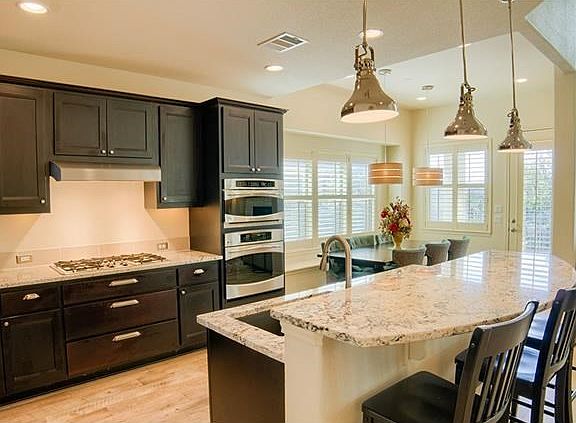 Loaded with upgrades including complete plantation shutters throughout, most lighting fixtures with 