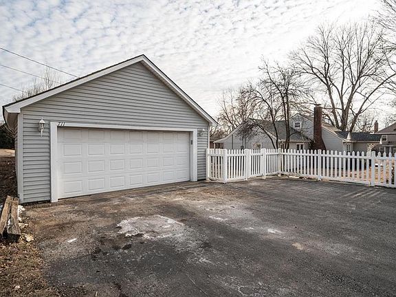 The 2 car detached garage also offers abundant off-street parking.   Notice the fencing which provides separation from the street and additional charm.
