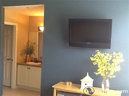 Master bedroom with mounted flat screen tv