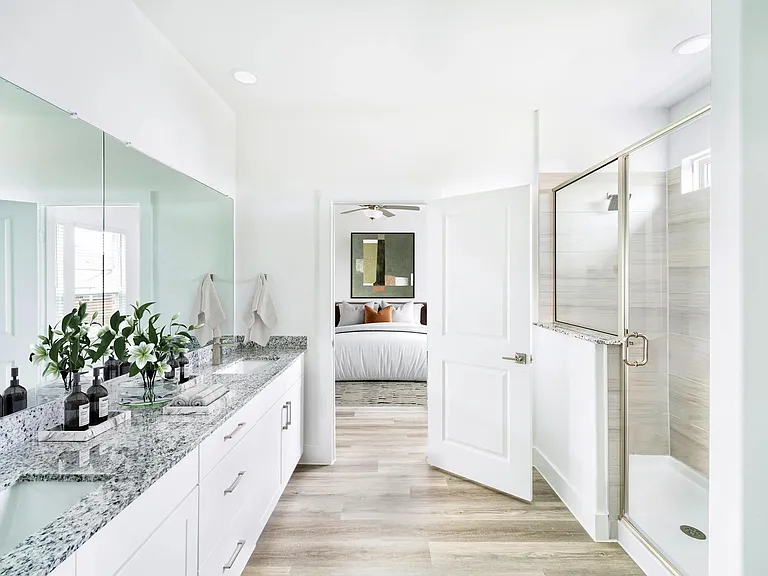 A bright, spa-inspired primary bath at Amavi Celina pairs sleek finishes with calming tones for a truly refined retreat near downtown Celina.
