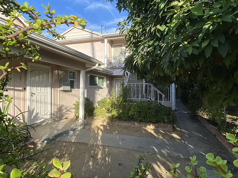 Calming, lush front patio of the 3 units.