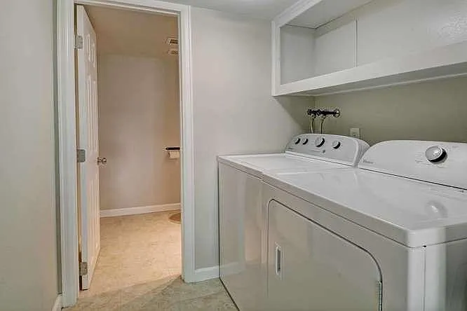 Washer/dryer with 2nd guest half bath- door to garage on lef