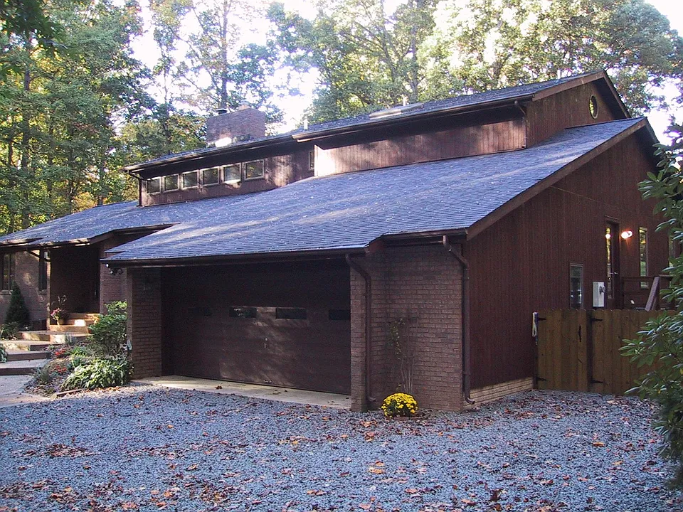Your parking is on the right side. You can see a gate leading to stairs that take you to rear deck and entry to unit
