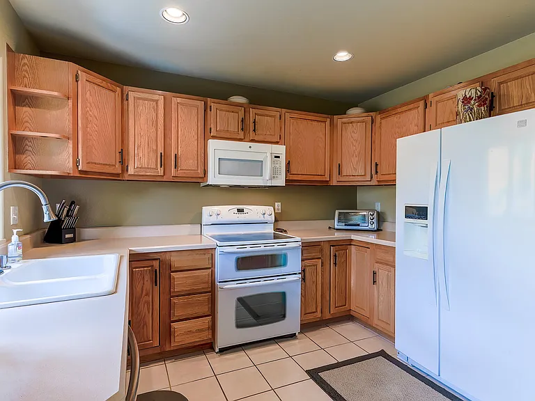 Kitchen stove with double oven, toaster oven, refrigerator with ice maker