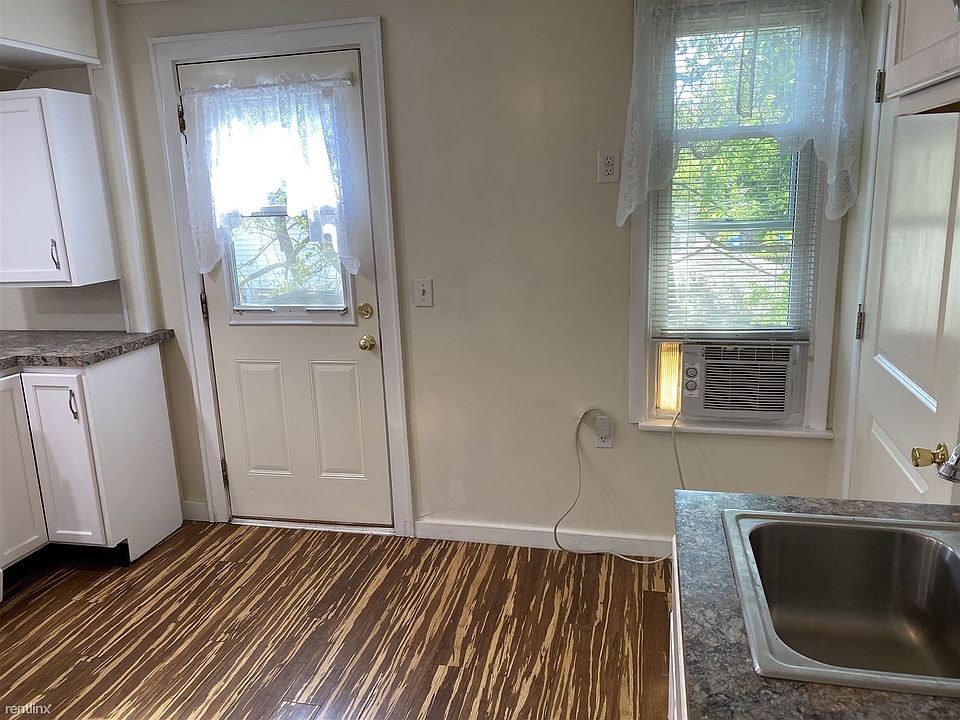 kitchen view eating area and air conditioner - door to back