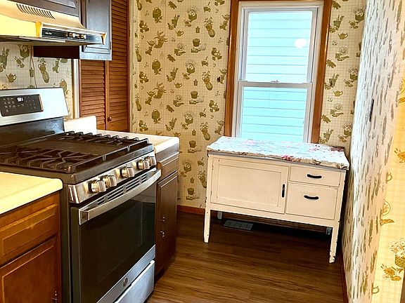 Pantry to the right of the oven. Oven has a griddle built in.