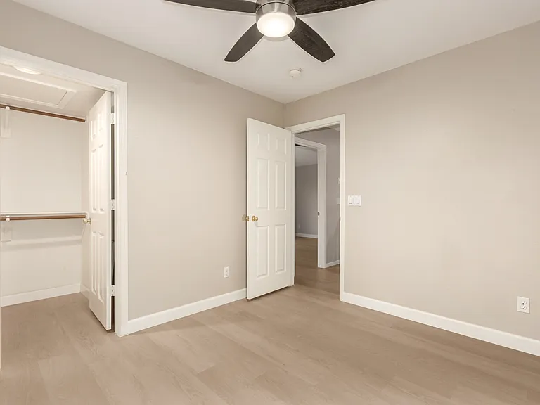 Convenient Downstairs Guest Bedroom with an Attached Full Bathroom