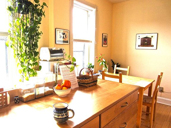 Handcrafted locally sourced maple cabinets and eat-in space in kitchen.