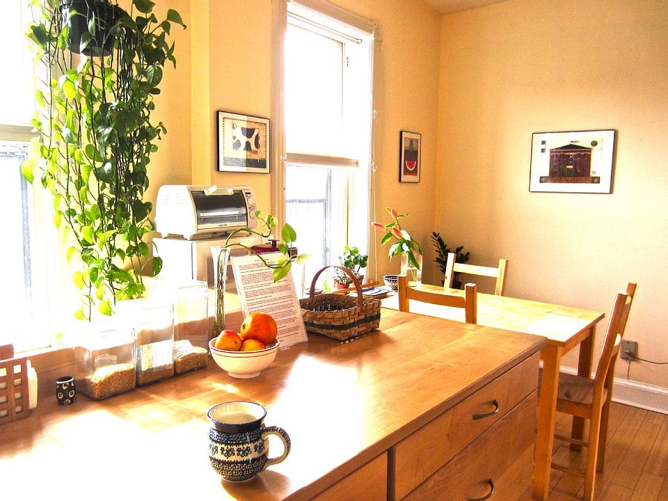 Handcrafted locally sourced maple cabinets and eat-in space in kitchen.