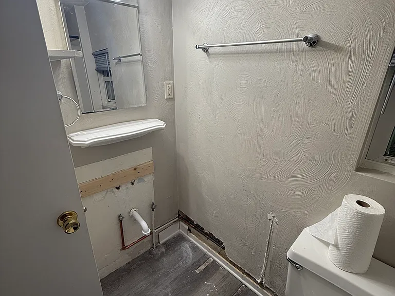 Vanity and sink in utility room and just needs reconnected after water line replacement