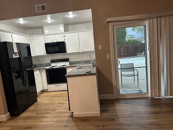 Kitchen- electric stove, dishwasher, refrigerator, microwave