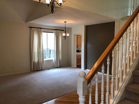 Formal dining area and kitchen access.