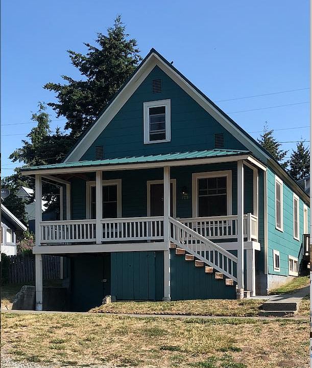 Covered front porch for year-round outdoor enjoyment or visiting with neighbors, Roslyn is a friendly place.
