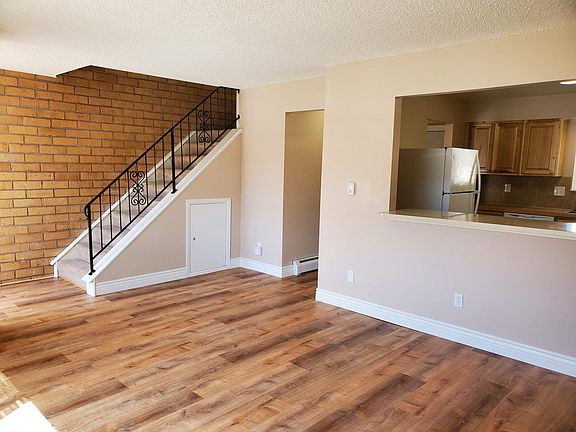 Living room with view of counter top and window into kitchen