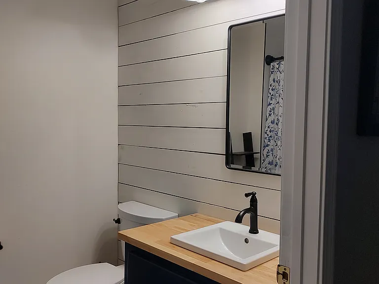 Hall Bath - Full bath, recently refinished with accent wall, modern lighting, Butcher block vanity and inset medicine cabinet for additional storage.