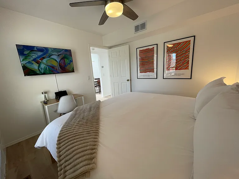 Upstairs Bedroom in king bed configuration, dedicated workspace, and Roku TV