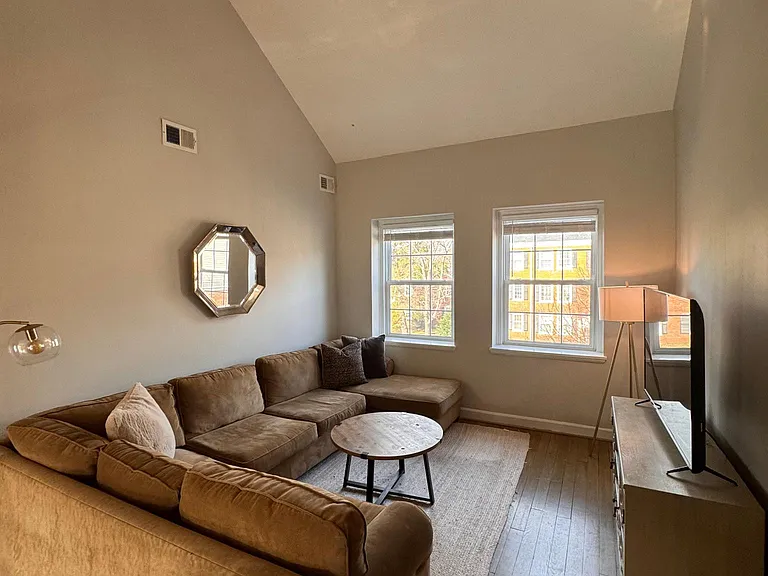 Light-filled Living rm with cathedral ceiling