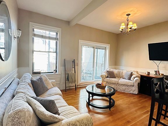 Living room that opens to back deck.