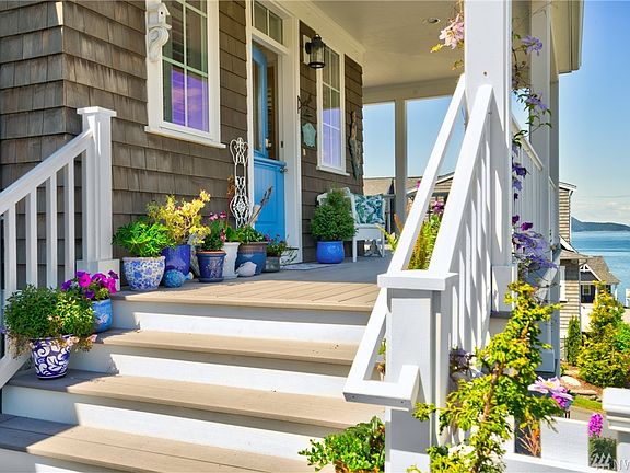 Welcome to your coastal retreat! Cape Cod charm abounds in this shingled beauty - from the welcoming Dutch door to the "beach co