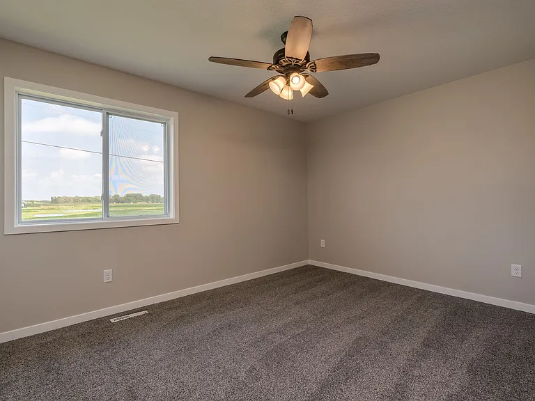 large secondary bedrooms with double closet doors.