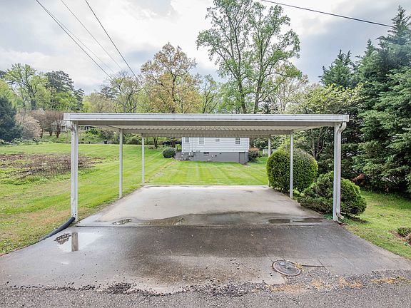 Covered parking along the rear of the property