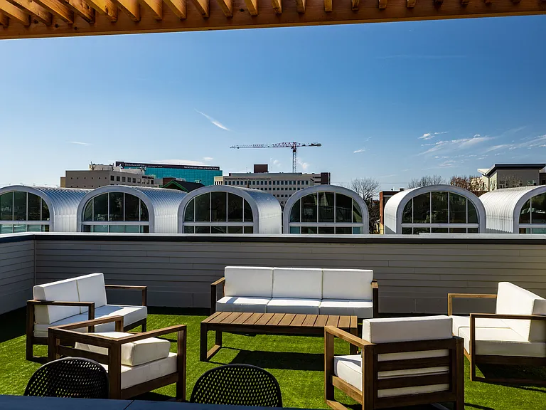 Enjoy your private patio on the 3rd floor. There is plenty of seating either under the pergola or not, there is a pool table that doubles as a table, TV, fans, and corn hole.