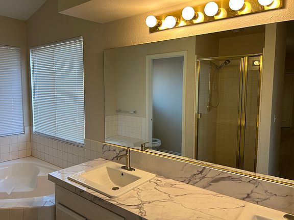 Double sink with quartz don't disturb off the Master suite bathroom
