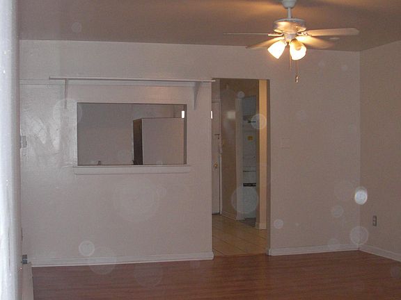 Main den living area with opening into the kitchen
