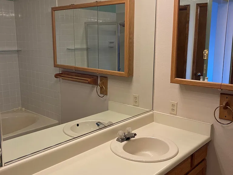 Master Bath as viewed from Linen Closet
Vaulted Ceiling
Large Sink Cabinet & Mirror
Three Panel Medicine Cabinet
Dimmable Lighting