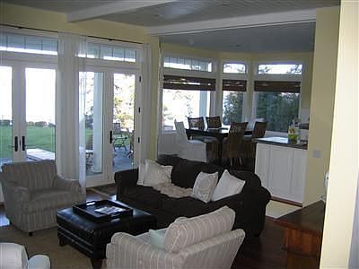 Open floor plan with a wall of windows and French doors brings the outside in. Recessed lighting, pl