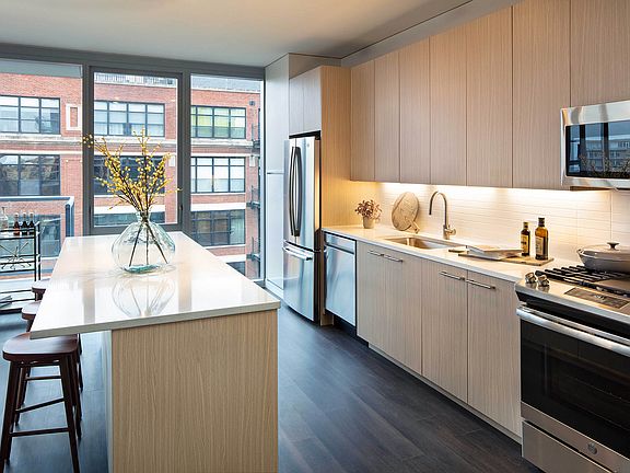 Elegant island kitchen with stainless-steel appliances