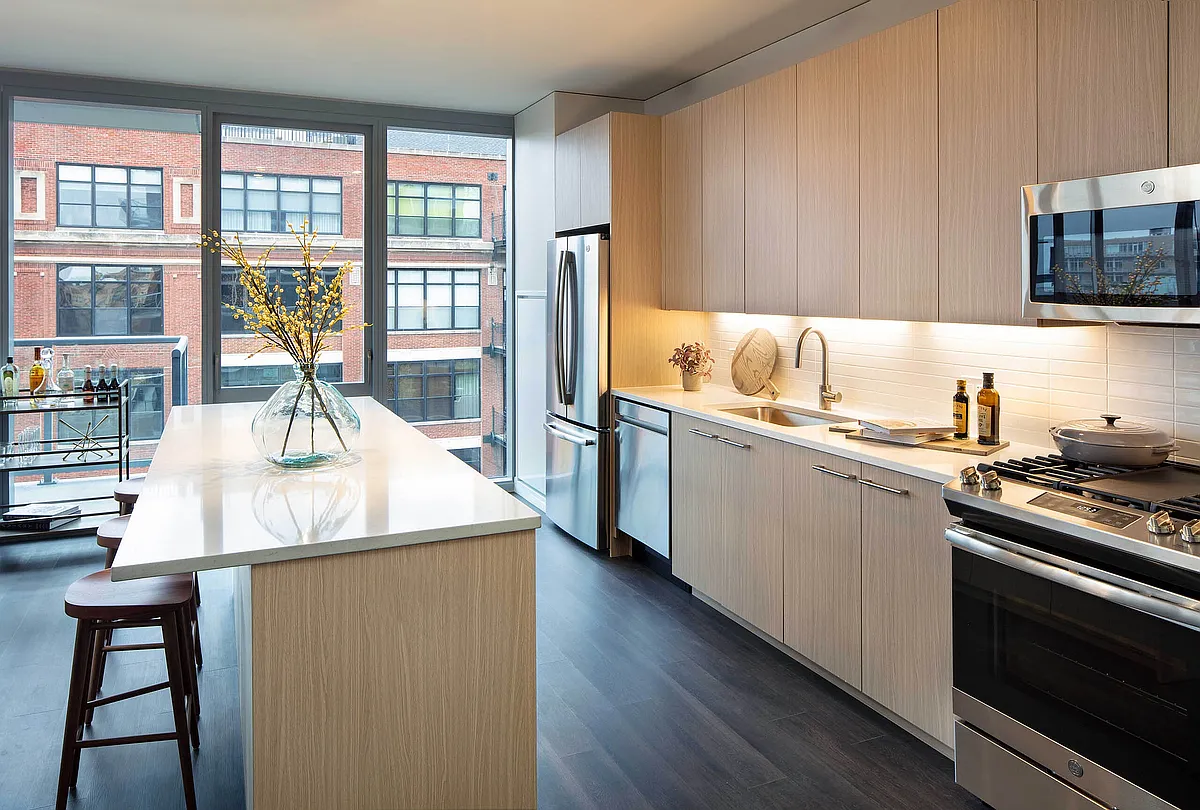 Elegant island kitchen with stainless-steel appliances - AMLI West Loop