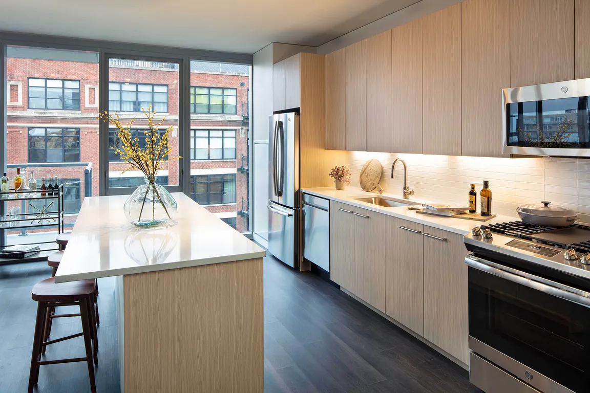 Elegant island kitchen with stainless-steel appliances
