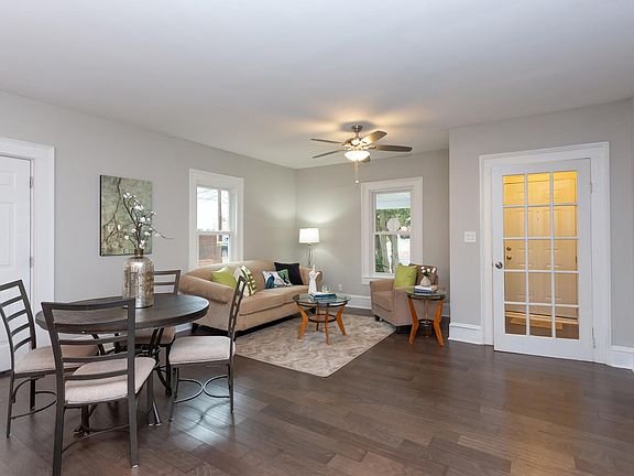 Open floor plan Living Room w. original 15 pane glass door entry foyer