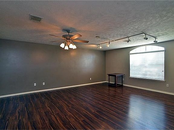 Open Family room with beautiful hardwood flooring.